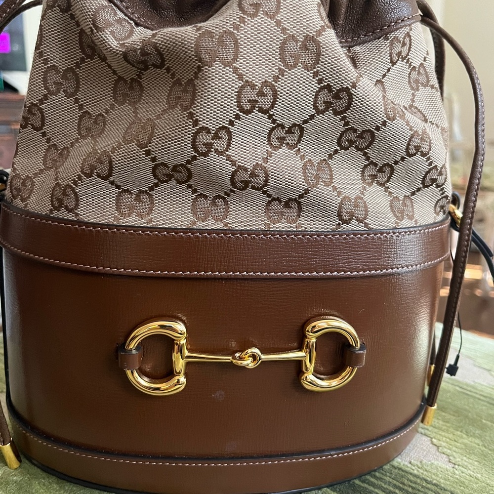 Gucci Drawstring Bucket Bag NWT Brown leather monogram Horsebit Buckle.